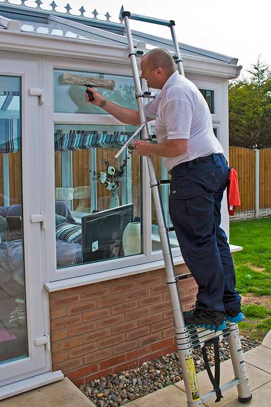 Man cleaning windows image